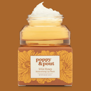 Poppy & Pout Wild Honey Moisturizing Lip Mask in open glass jar with floral product packaging