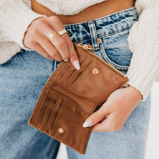 Pretty Simple Kat Suede Wallet in brown open to show interior card slots, snap closure and zip pocket