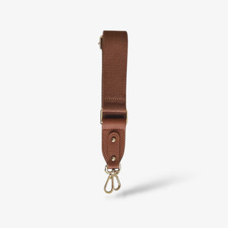Pretty Simple Simply Solid Bag Strap in brown with gold hardware, adjustable replacement purse strap shown front view on a white background.
