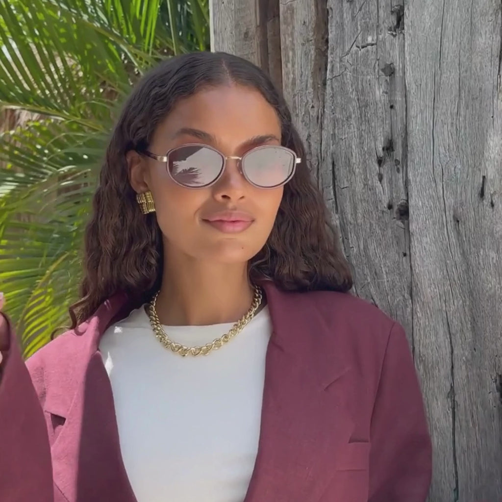 FREYRS Jordan oval sunglasses with burgundy frame and brown gradient lenses worn by model video view
