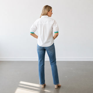 White puff sleeve button down top back view showing gathered sleeves and relaxed fit