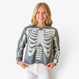 Queen of Sparkles charcoal skeleton sweatshirt with iridescent jeweled rib cage and sleeve details, close-up front view