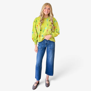 Queen of Sparkles lime green skeleton sweatshirt with colorful embroidered skeletons and sequins, full front view