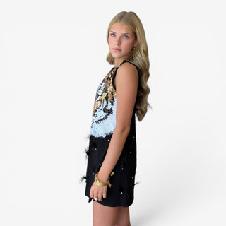 Queen of Sparkles LSU black sequin tiger dress with sleeveless silhouette and feather embellishments, left side view