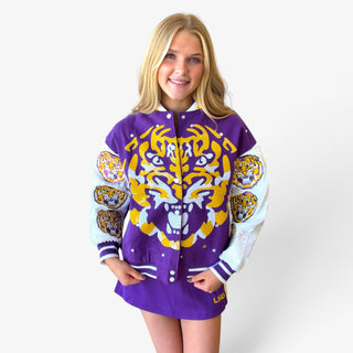 Queen of Sparkles LSU Bomber Jacket in purple and gold with oversized tiger design and white sequin sleeves, front view