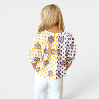 Back view of Queen of Sparkles LSU polka dot top with split purple and gold polka dot print and sequin tiger details