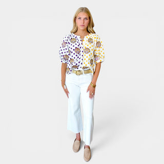 Queen of Sparkles LSU polka dot top with purple and gold tiger print shown front view with white jeans