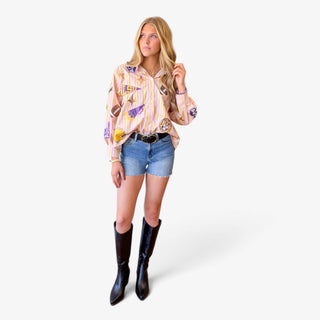 Queen of Sparkles LSU striped gameday long sleeve top with sequin football and LSU patches styled with denim shorts front view