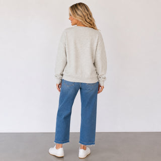 Queen of Sparkles teacher sweatshirt in heather grey showing the plain back, relaxed silhouette and hip-length fit, back view