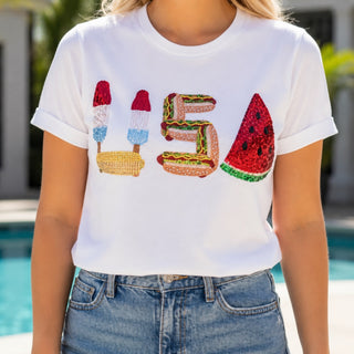 Queen of Sparkles USA tee sequin graphic detail featuring popsicles, corn, hotdog and watermelon, close-up view