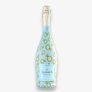 Bottle wrap with a blue background and an engagement ring design for LaMarca Prosecco on a white background