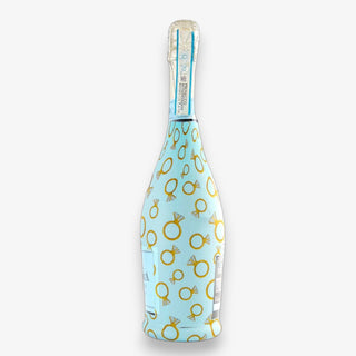 Bottle wrap with an engagement ring design on a white background