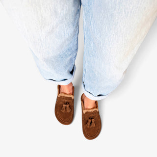 Sam Edelman Astrid Cozy Suede Mule in Warm Nutmeg shown from above with suede tassels and shearling-style trim.