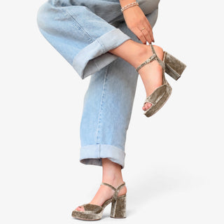 Sam Edelman Fleur brown velvet platform sandal shown in a side lifestyle view with chunky heel and light wash jeans.