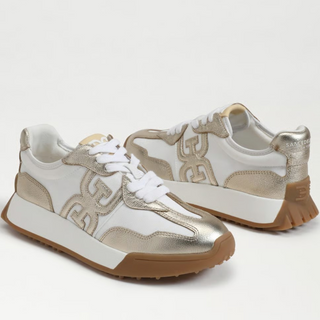 Pair of Sam Edelman Langley metallic gold and white sneakers with gum soles, angled product view