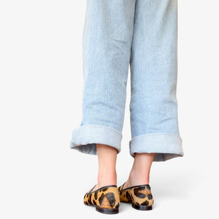 Sam Edelman Loraine leopard print Brahma hair loafer on model, back view showing heel and animal print finish