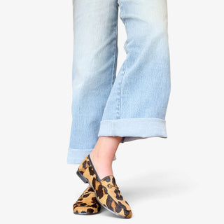 Sam Edelman Loraine Bit Loafer in leopard print Brahma hair on model, front angled view with gold bit detail