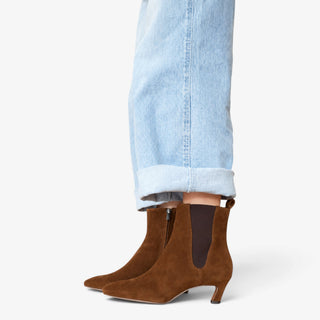 Sam Edelman Peony ankle boot in Warm Nutmeg suede shown from the side with pointed toe, kitten heel and elastic panel.