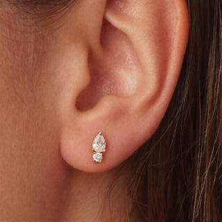  Saône 18K gold non-tarnish CZ teardrop and round crystal earring shown on ear, close-up view