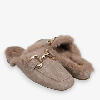Pair of taupe mules with faux fur trim, low heel and gold buckle on a white background