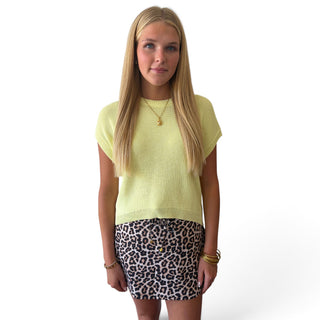 Women’s soft yellow knit short sleeve top with round neckline and relaxed silhouette, front detail view