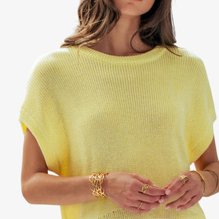 Soft yellow short sleeve knit top with relaxed boxy fit and wide sleeves, front view styled with white drawstring pants.