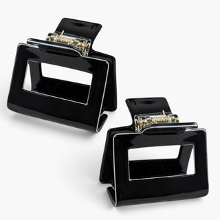 Small black square hair claw clips with glossy finish and open center cutout, shown in two product views.
