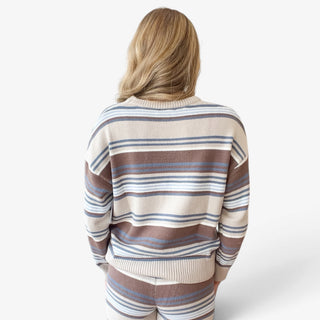 Striped sweater pant set in cream, brown and blue shown from back, highlighting striped knit sweater and ribbed hem