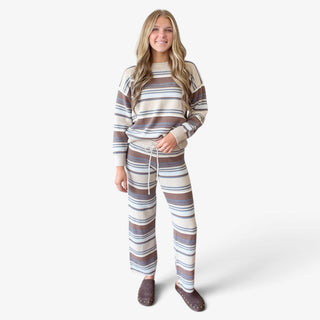 Striped sweater pant set in cream, brown and blue shown on model, full front outfit view with wide leg knit pants