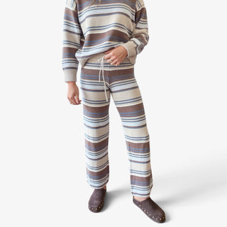 Striped sweater pant set in cream, brown and blue, front view highlighting drawstring waist and straight leg knit pants