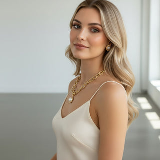 Model wearing Susan Shaw Pearl Cab Chain Necklace with pearl pendant and textured gold chain side profile view
