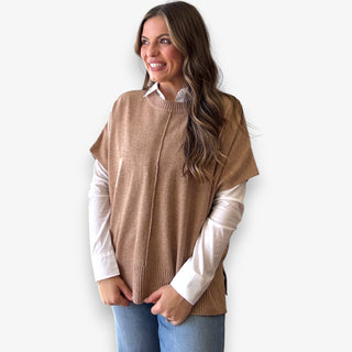 Camel knit layered top styled over white button down blouse on woman model for casual polished look
