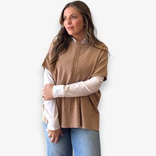 Camel knit layered top styled over white button down blouse on woman model for casual polished look