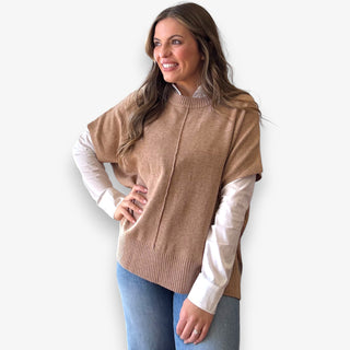 Camel knit layered top styled over white button down blouse on woman model for casual polished look