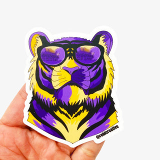 LSU tiger sticker decal with purple and gold tiger wearing sunglasses flat lay view