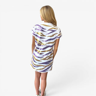 Back view of white short sleeve tiger striped dress with purple and gold sequin stripes styled with sneakers