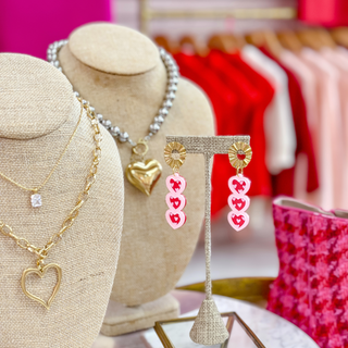 Leah Valentine heart drop earrings with pink stacked hearts and gold-tone stud tops