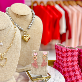 Pretty in Pink heart drop earrings with pink confetti texture and gold-tone details