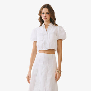 White puff sleeve crop top with pintuck detail and collared neckline styled with ivory high waisted skirt