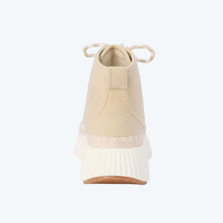 Beige sneaker with white sole on a white background