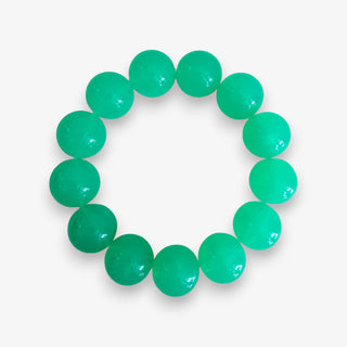 Turquoise jelly bead stretch bracelet with glossy oversized round beads shown in a flat lay product view.
