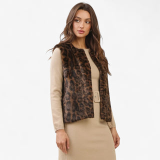 Leopard print faux fur vest with open front design styled over a beige dress