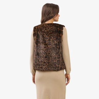 Leopard print faux fur vest with open front design styled over a beige dress