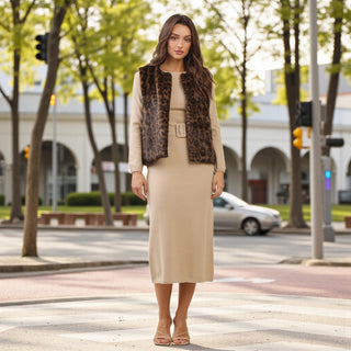 Leopard print faux fur vest with open front design styled over a beige dress