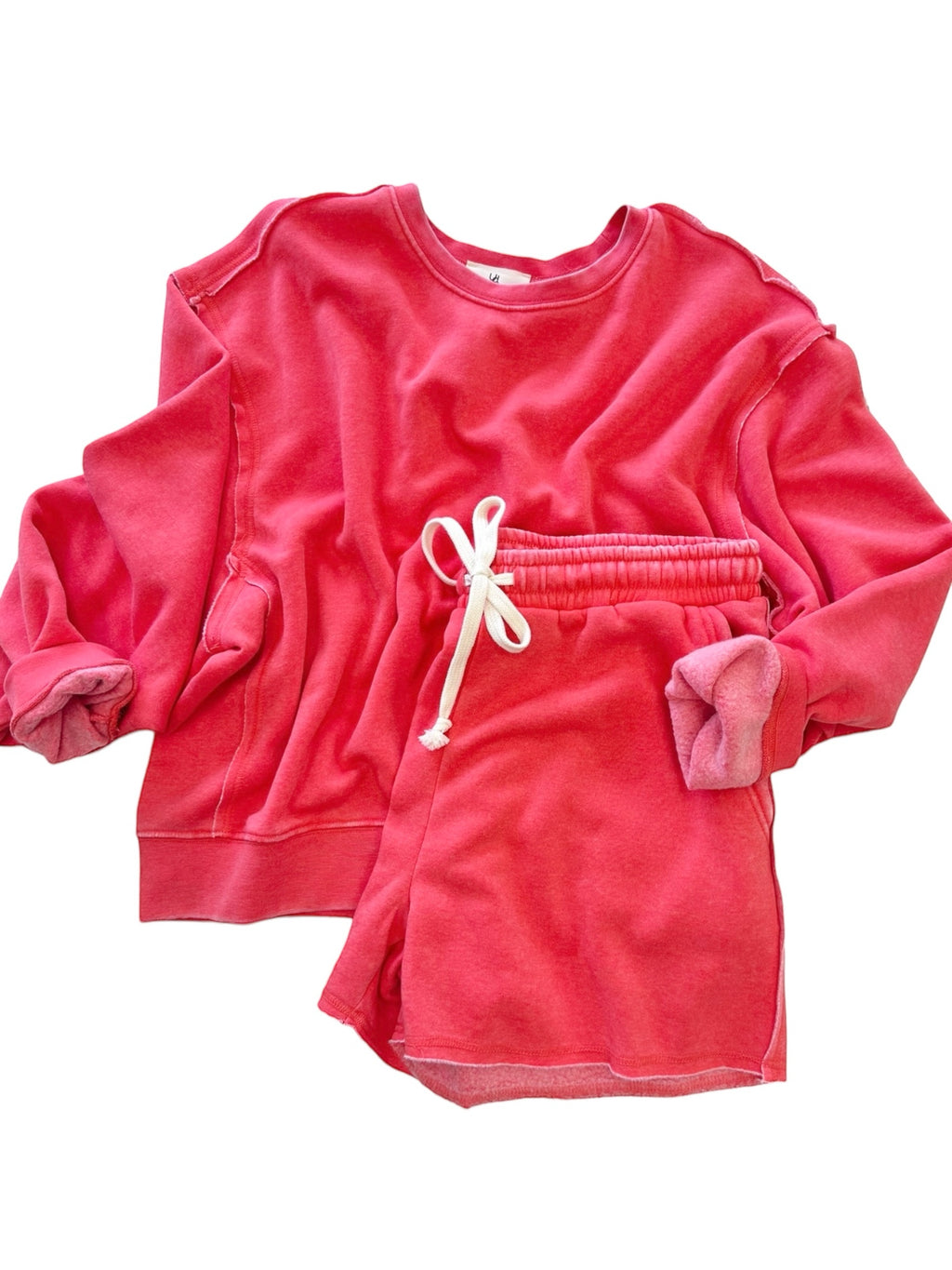 Watermelon Red Molly Sweatshirt and Short Set with a crew neckline, ribbed cuffs, elastic waistline and frayed hem perfect for stylish and comfortable lounging.