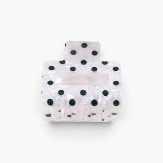 Pearl white polka dot hair claw clip in small 2-inch size with dark green dots, front product view