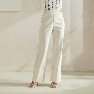Ivory high-rise button front trousers with gold button detail and straight-leg fit