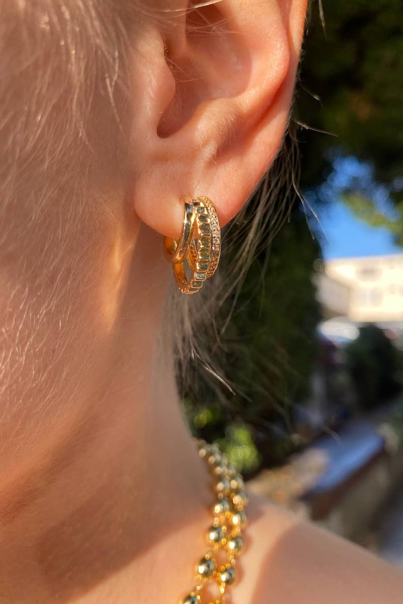 Triple huggie earrings in 14k gold vermeil with cubic zirconia gemstones.